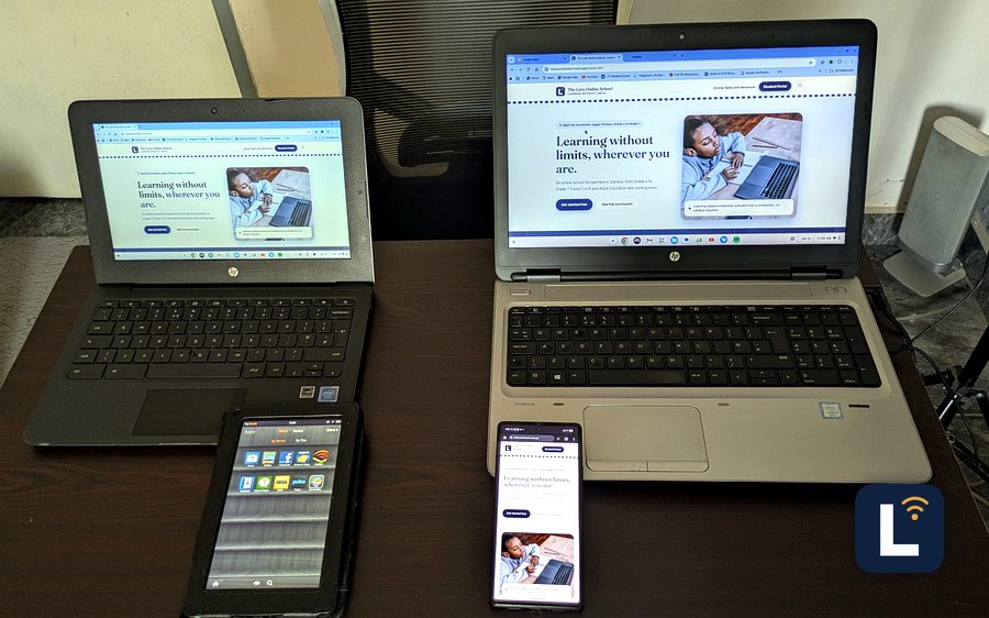 The Lory Online School site shown on laptops, a tablet, and a phone
